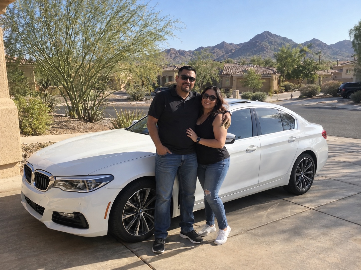 Illustrative candid scene of vehicle owners beside a luxury vehicle for the Arizona guide